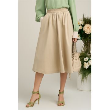 Fusta midi din bumbac bej cu elastic in talie si buzunare functionale Fusta midi din bumbac bej cu elastic in talie si buzunare functionale
